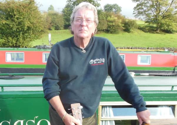 Chris Simpson outside his narrow boat on the Leeds and Liverpool Canal near Skipton.