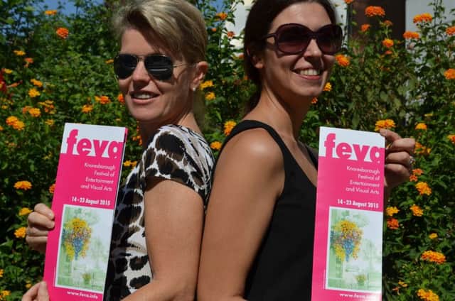 Feva volunteers Astrid, left, and Caroline, right with the 2015 Knaresborough feva programme.