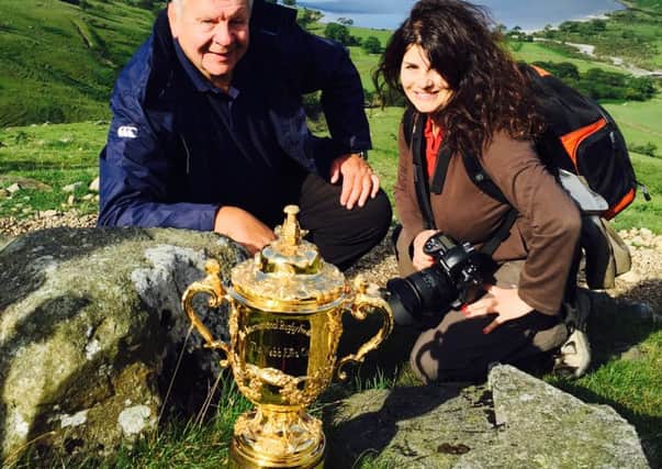 Harrogate photographer Jude Palmer with the Rugby World Cup and England rugby legend Bill Beaumont.