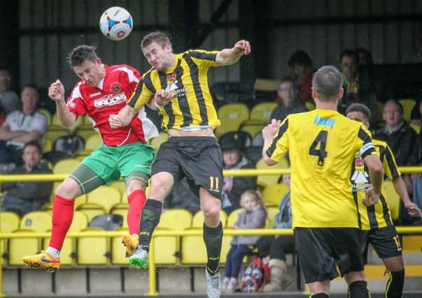 Harrogate Railway's Dan Thirkell and Town's Louie Swain battle for the bal l (Photo: Caught Light Photography)