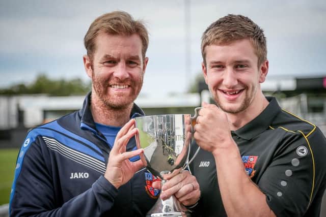 Harrogate Town manager Simon Weaver and Louie Swain lifting the John Smith's Cup (Photo: Caught Light Photography)