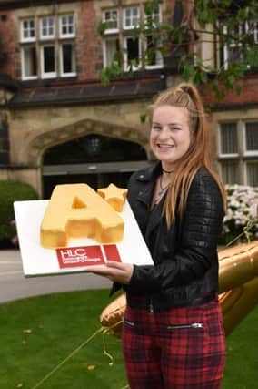 Harrogate Ladies College student Frankie Wood, celebrates A* grades with a madeira cake specially prepared by the schools award winning Catering Team