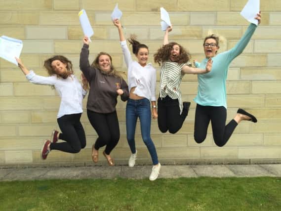 St Aidan's and St John Fisher Associated Sixth Form students Katie Derham, Emma Robinson, Caitlin Edwards, Lydia Bradd and Vicki Houseman, all 18, celebrate after getting their A level results.