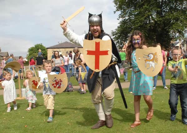 NAKP 1508221AM1 K'boro Medieval Day. Will Burnham instructs youngsters on how to attack at this years Knaresborough Medieval Day.  (1508221AM1)