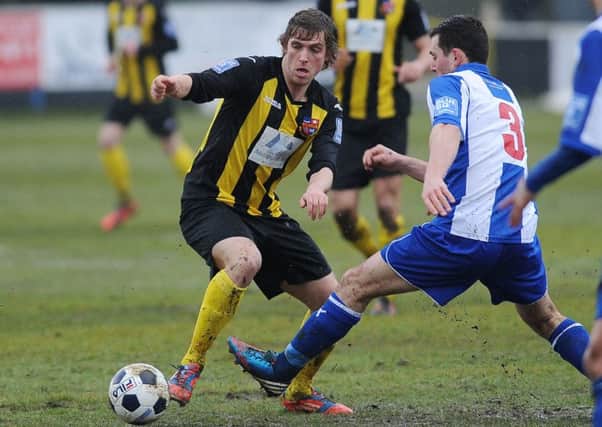 Tom Platt keeps his eyes on the ball in a previous spell with Town