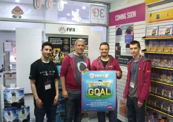 The GAME team: Left to Right Zaim Zulffkar, Rob Kitching, Nick Willford, Steven Scurr get ready to celebrate the launch of FIFA 16 with their midnight event (NADV-17-09-15 WEB)