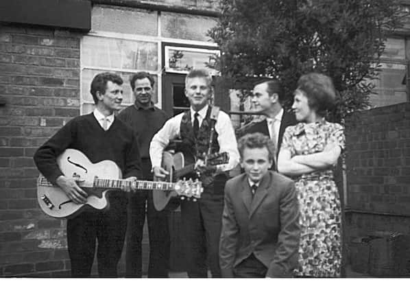 Brian Dunn with family members and  Joe Brown in 1962. Brian is pictured with guitar on the left.