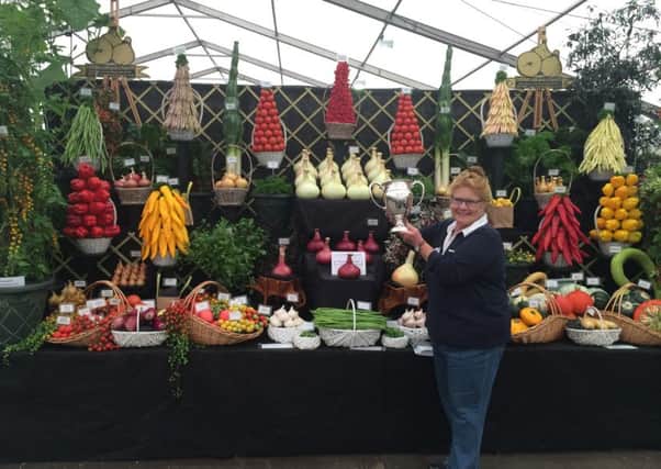 Director of Robinson's, Margaret Robinson stands in front of their display which won best in show at Harrogate Autumn Flower show