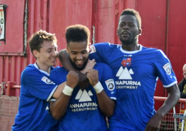 Jack Emmett and Cecil Nyoni join goalscorer Brendan Daniels, centre, following Town's late goal (Photo: Craig Hurle)