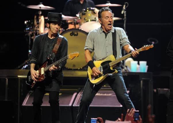 Guitarist Nils Lofgren, left, on stage with Bruce Springsteen at Leeds Arena on July 24, 2013. (picture by Mark Bickerdike)