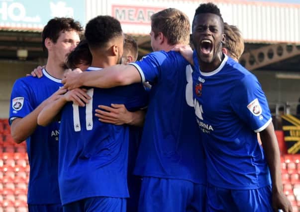 Harrogate Town players celebrate the last minute winner against Gloucester City (Photo: Craig Hurle)