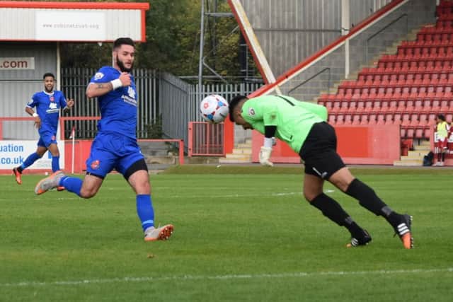 Dom Knowles is thrwarted by Gloucester City's goalkeeper Jasbir Singh (Photo: Craig Hurle)