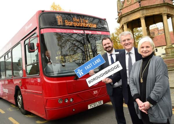 Transdevs Alex Hornby, MP Andrew Jones and Boroughbridge Deputy Mayor Liz Vose launch the new 1A service.