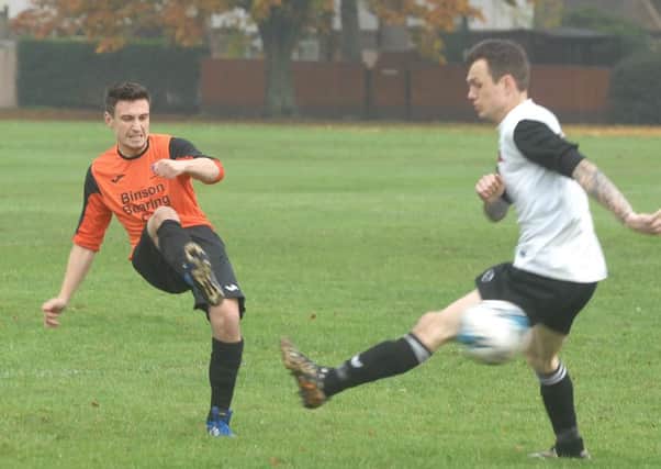 Dan Windham passes the ball forward for Wetherby Athletic (1510311AM15)
