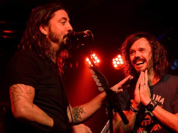 The UK Foo Fighters' Jay Apperley on stage with Dave Grohl in Brighton. (Picture by Kalpesh Patel)