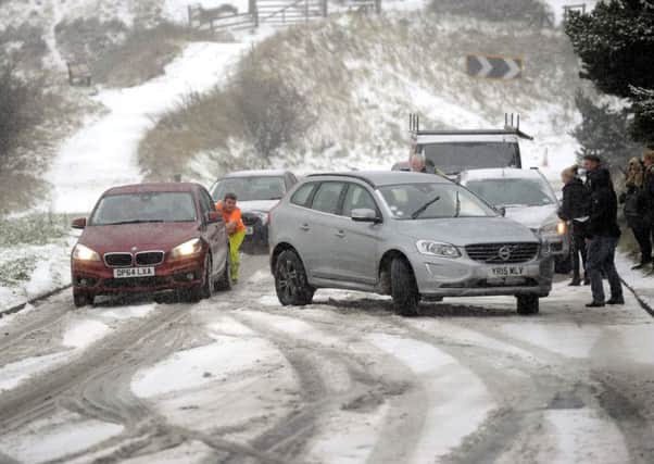 Vehicles are pushed up the Pickering to Whitby road in North Yorkshire at the weekend