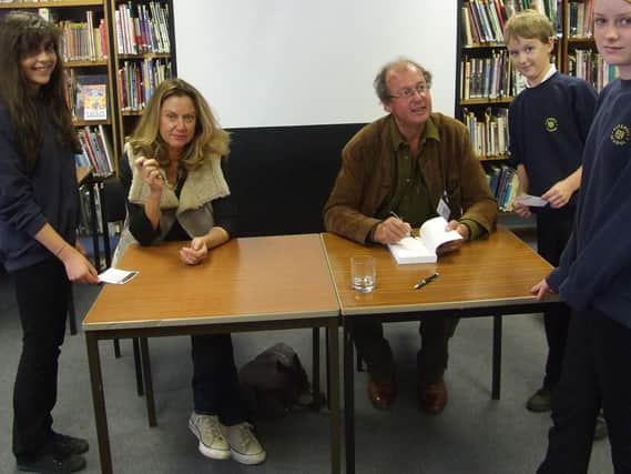 Harrogate author Tony Wild and co-writer Diana De Gunzburg signing copies of their Moonstone Legacy Trilogy which inspired a Gotan Project-style remix of The Age of Aquarius for current climate change protests.