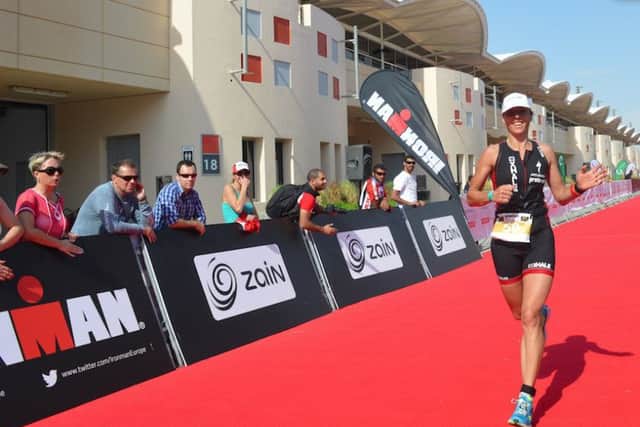 Caroline Livesey approaches the finish in Bahrain, where she clocked a time under four hours