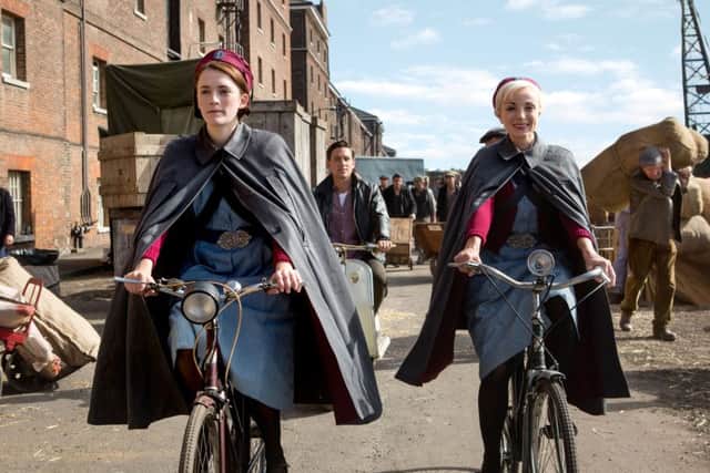 Call The Midwife Nurse Trixie Franklin (Helen George), Nurse Barbara Gilbert (Charlotte Ritchie). Photographer: Sophie Mutevelian.