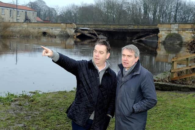 Nigel Adams MP, left, discusses potential sights for a temporary footbridge
