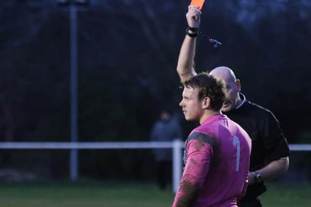 Winterton goalkeeper Adam Stevens is shown the red card for a second yellow after an angry reaction to Jonty Maulin's  challenge (Photo: Craig Dinsdale)