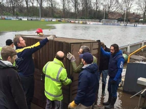 Tadcaster's players and supporters have helped in the clean up mission to get the i2i Stadium back playable