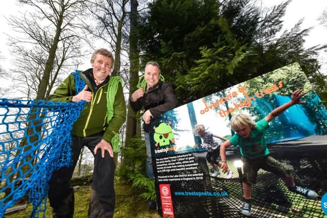Mike Turner, owner of Treetop Nets, and Mark Bainbridge, general manager at Lightwater Valley theme park, celebrate the forthcoming arrival of the new attraction. (S)