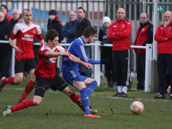 George Eustance slides into a tackle, watched on by boss Paul Stansfield (Photo: Craig Dinsdale)