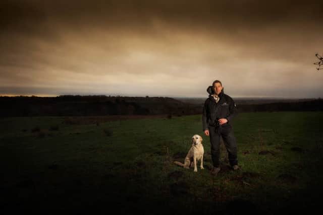 TWILIGHT ZONE: Gareth Doherty ventures out of Cropton Forest with his dog Brodie.
