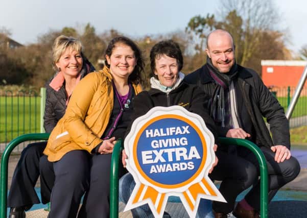 20160201 Copyright onEdition 2016Â©
Free for editorial use image, please credit: onEdition

Kazia Knight celebrates winning the local Halifax Giving Extra Awards for York.

Halifax Giving Extra Awards Halifax Giving Extra Awards Winner Kazia Knight (third from left, with rosette), with, from left, Louise Shirley (Assistant Branch Manager), Paige Millward (Banking Consultant), and Daniel Williams (Local Director) 

Following the success of the Halifax Giving Extra Awards over the last two years, Halifax sought to recognise even more people who always go above and beyond to help others. The Giving Extra Awards programme is a UK-wide search for people who go the extra mile to give something back.

For more information please contact: Halifax@fourcommunications.com

If you require a higher resolution image or you have any other onEdition photographic enquiries, please contact onEdition on 0845 900 2 900 or email info@onEdition.com
This image is copyright onEdition 2015Â©.
This image has been supplied by onEdition