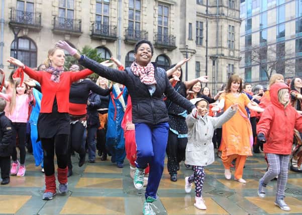 Dancing in the rain, the One Billion Rising flash dance in the Peace Gardens