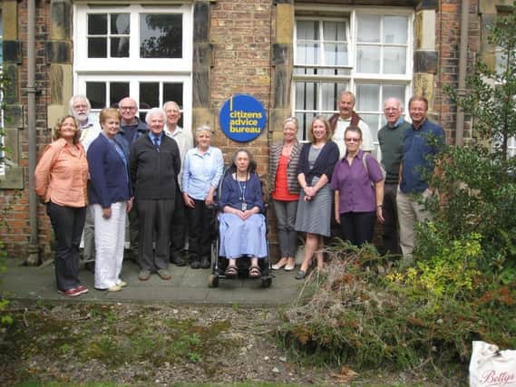 Staff and trustees at Citizens Advice Bureau on Allhallowgate, Ripon, celebrate the bureau's 75th anniversary in 2014.