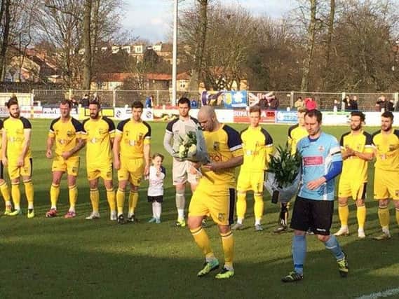 The captain's of Tadcaster Albion and Liversedge present flowers to Anna-Marie Clark, mother of Sonny Lang.