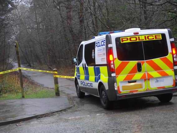 The crime scene remains cordoned off.
