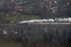 An aerial view of the Flying Scotsman going over the Digswell Viaduct near Welwyn Garden City on its inaugural run from London to York after a decade long, Â£4.2 million refit. (Picture: Steve Parsons/PA Wire)
