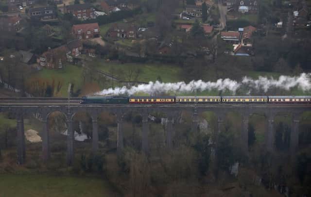 An aerial view of the Flying Scotsman going over the Digswell Viaduct near Welwyn Garden City on its inaugural run from London to York after a decade long, Â£4.2 million refit. (Picture: Steve Parsons/PA Wire)