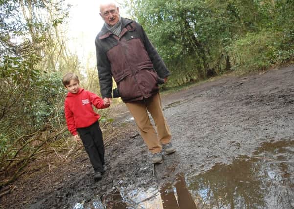 Valley Gardens muddy path. Colin Gibbs and his grandson Ethan. (1602234AM1)
