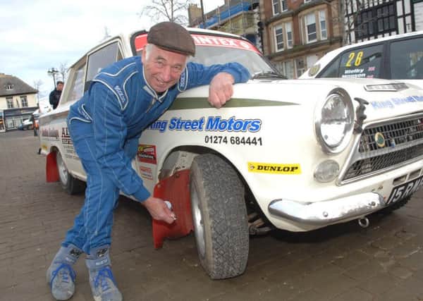 Riponian Rally.  Yorkshire rally legend Bob Bean (77) checks the tyres on his 53-year-old Lotus Cortina