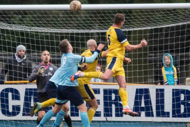 Gregg Anderson heads in Tadcaster's second (Photo: Ian Parker)