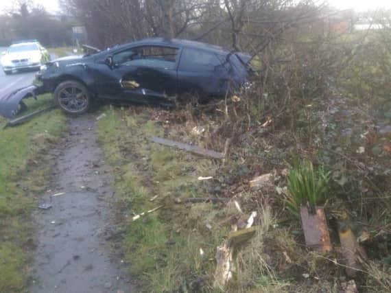 The car was left in a ditch after it left the road.