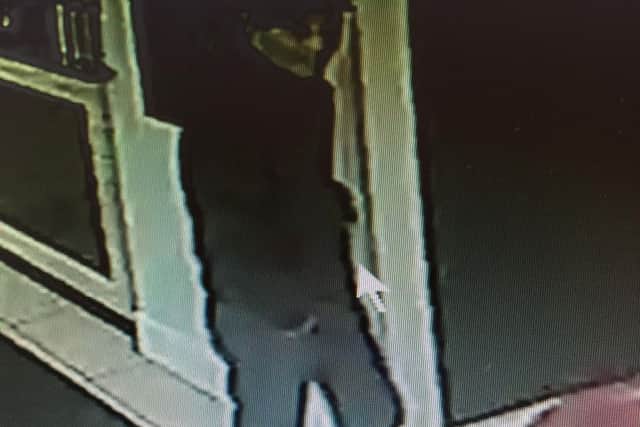 A full body CCTV image of the suspected burglar