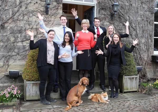 Staff at the Boars Head in Ripley celebrate after scooping the accolade of the UKs Best Pet Friendly Hotel in LateRoom.coms annual Simply the Guest Awards.