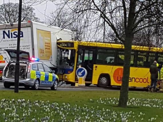 A school bus has crashed into a lorry on the Empress roundabout.