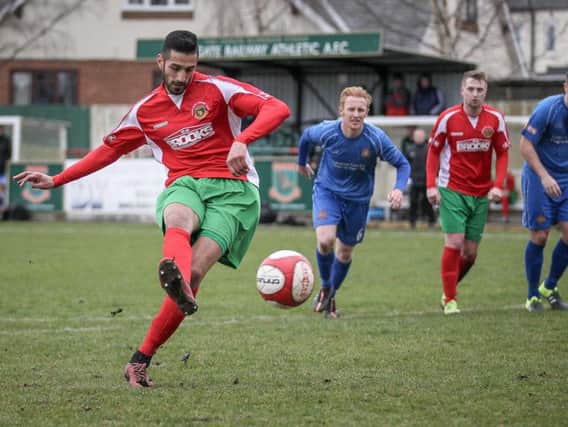 Amar Purewal scores a penalty for Harrogate Railway against Clitheroe (Photo: Caught Light Photography)