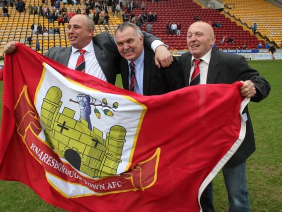 Terry Hewlett, centre, celebrating the 2014 League Cup win at Valley Parade (Photo: Craig Dinsdale)