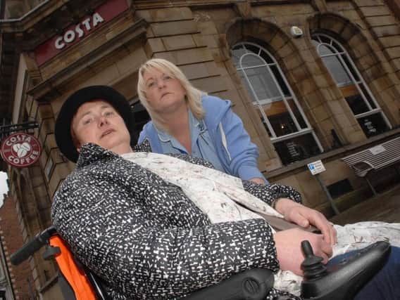 Avril Wordsworth with carer, Sarah Thackwray outside her local Costa branch. Picture: Adrian Murray