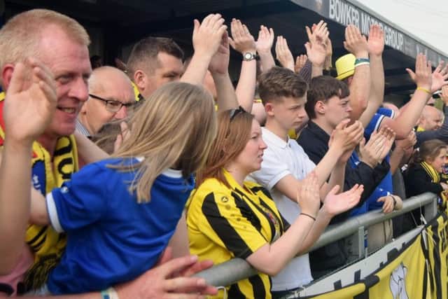 The Harrogate Town fans applaud the team's efforts at full-time (Photo: Craig Hurle)