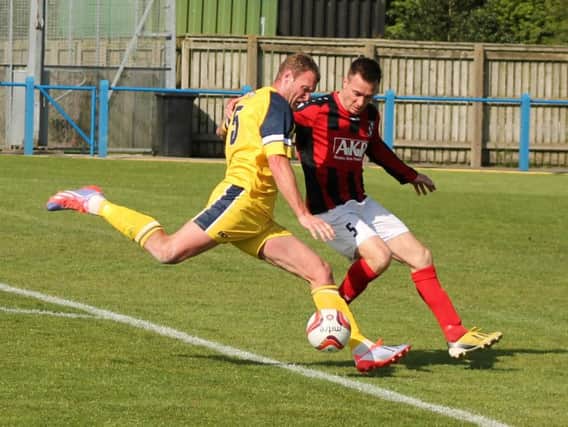 Gregg Anderson clears his lines for Tadcaster Albion against Cleethorpes (Photo: Keith Handley)