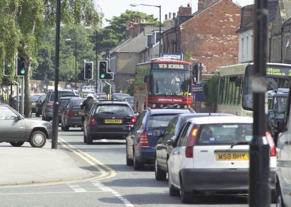 Greater use of public transport is the key to reducing town centre congestion.