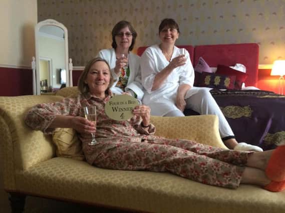 Winner - Knaresborough's Newton House owner Denise Carter (front, seated), Nikki Langford-Young (left)  and Jackie Fennell (right).